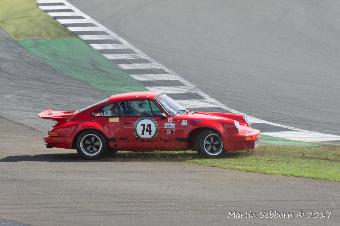 A Porsche doing what they do best - spinning off!