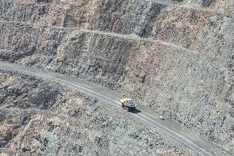 Spot how big the dumper truck is by looking at the car just by it!